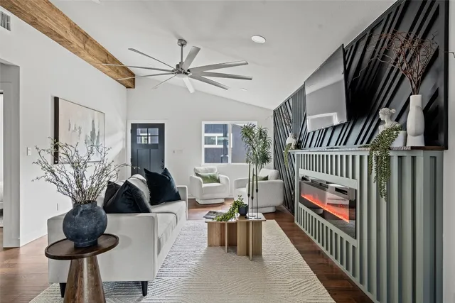 a living room with furniture and a fireplace