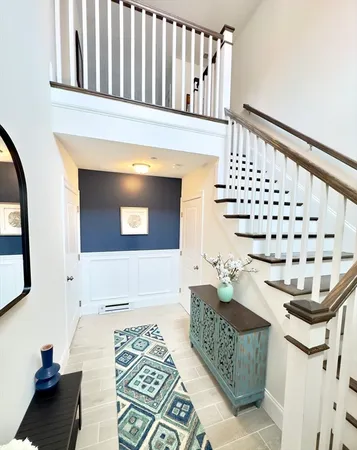 a living room with furniture and a rug