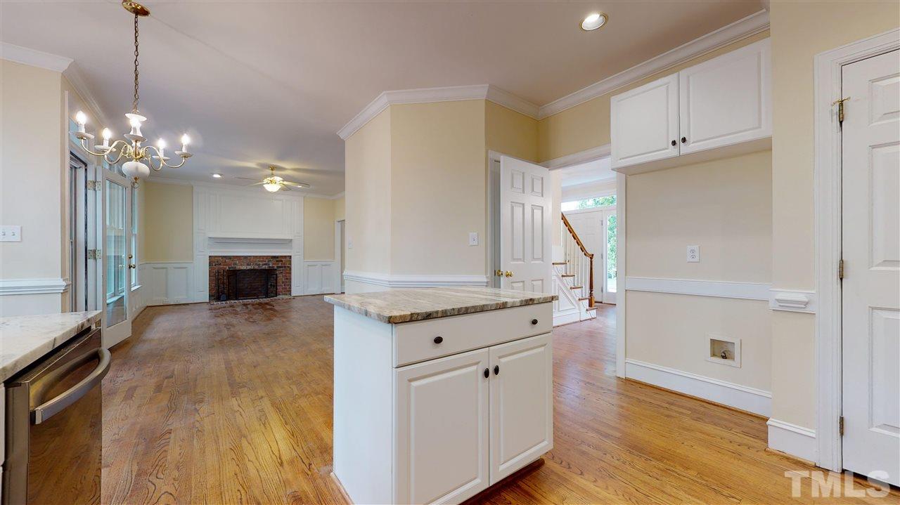 9509 Brimstone Lane Raleigh, NC 27613 - Photo 15 of 30 Kitchen has new stainless steel appliances (Samsung Stove & microwave +Bosch Dishwasher).Pantry. Finished Hardwood Floor. Cased opening to Dining Room. Overlooks back yard.