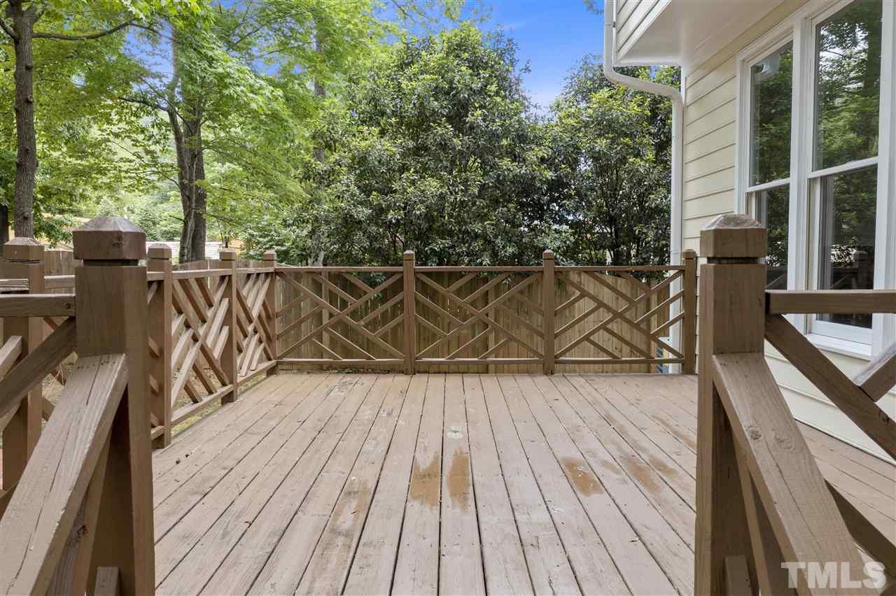 9509 Brimstone Lane Raleigh, NC 27613 - Photo 26 of 30 Spacious Deck is located off Family Room and is accessed by glass door.