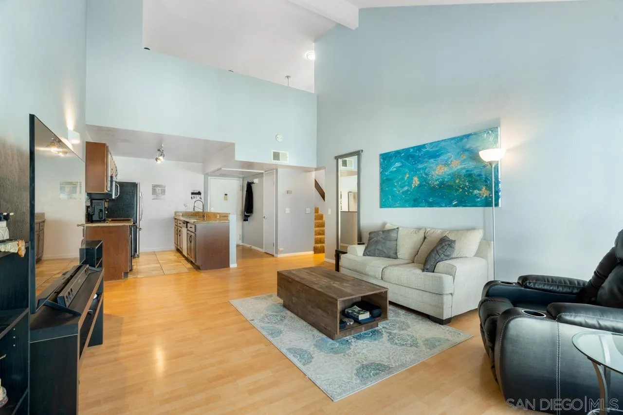 6191 Rancho Mission Road, Unit 308 San Diego, CA 92108 - Photo 1 of 31 a living room with furniture and a flat screen tv