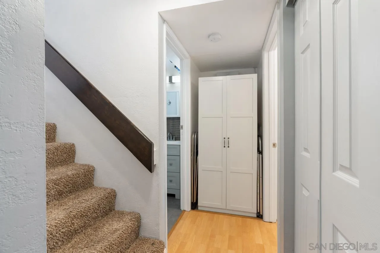 6191 Rancho Mission Road, Unit 308 San Diego, CA 92108 - Photo 11 of 31 a view of entryway and hall with wooden floor