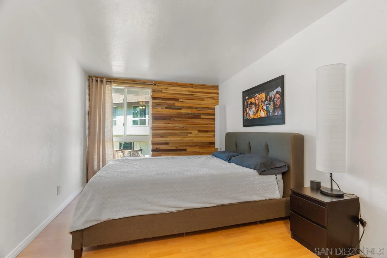 6191 Rancho Mission Road, Unit 308 San Diego, CA 92108 - Photo 13 of 31 a bedroom with a bed and dresser