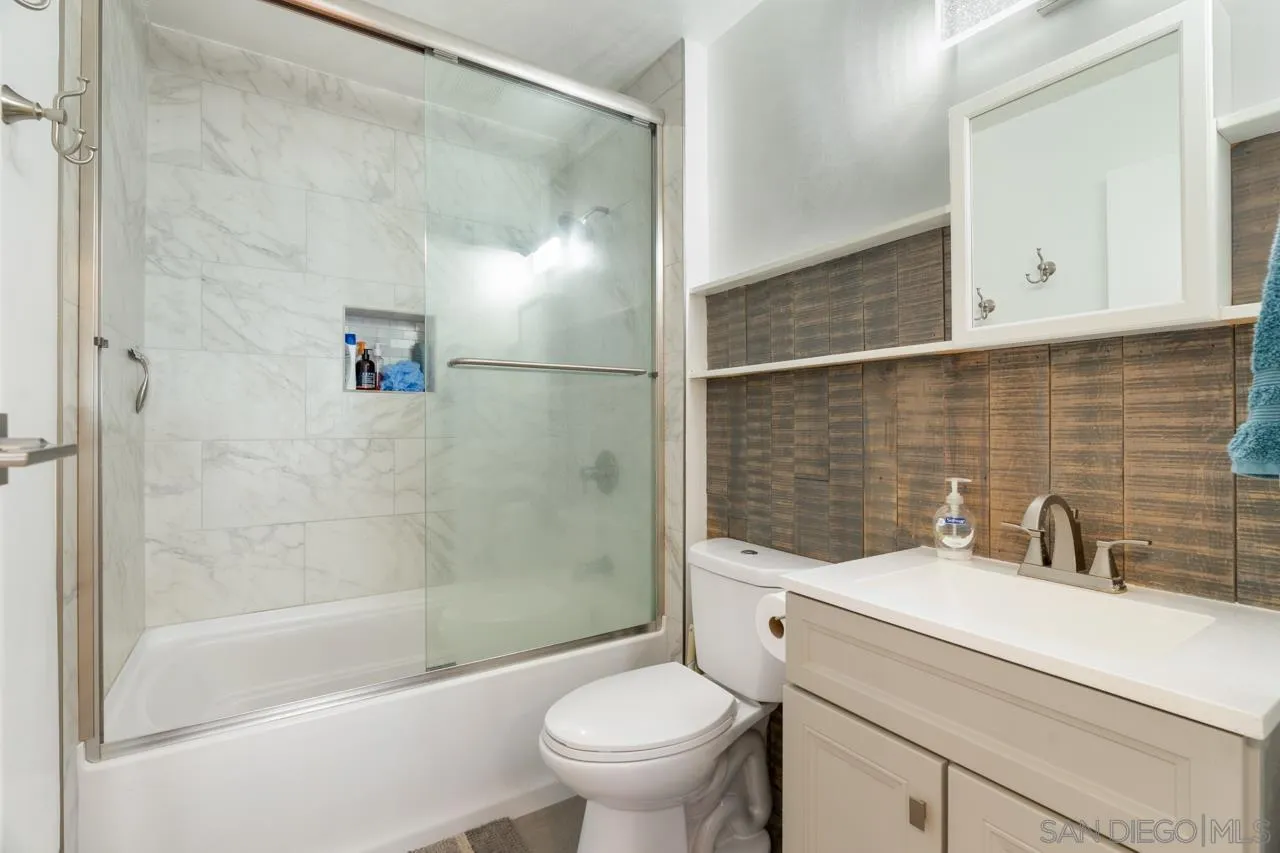 6191 Rancho Mission Road, Unit 308 San Diego, CA 92108 - Photo 15 of 31 a bathroom with a sink a toilet and shower