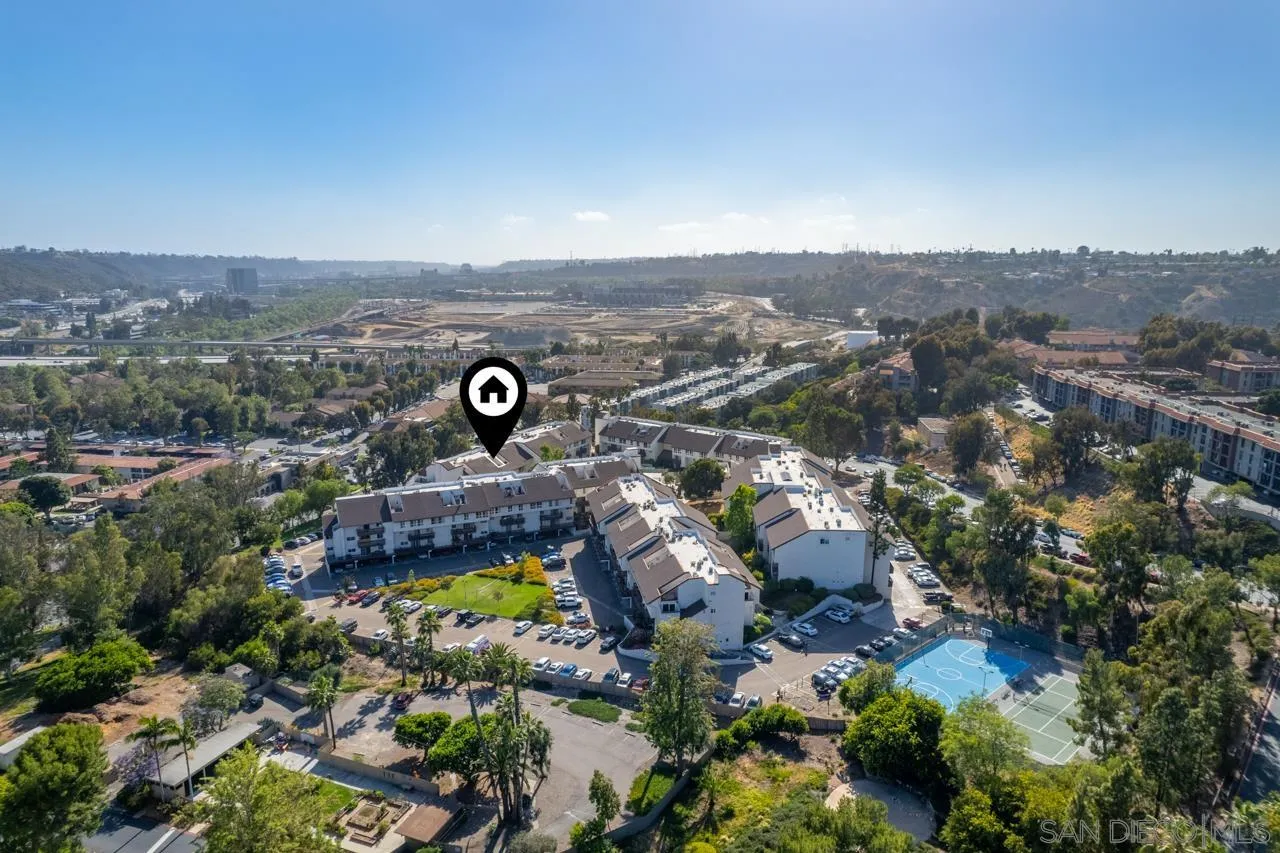 6191 Rancho Mission Road, Unit 308 San Diego, CA 92108 - Photo 24 of 31 an aerial view of a house with a yard