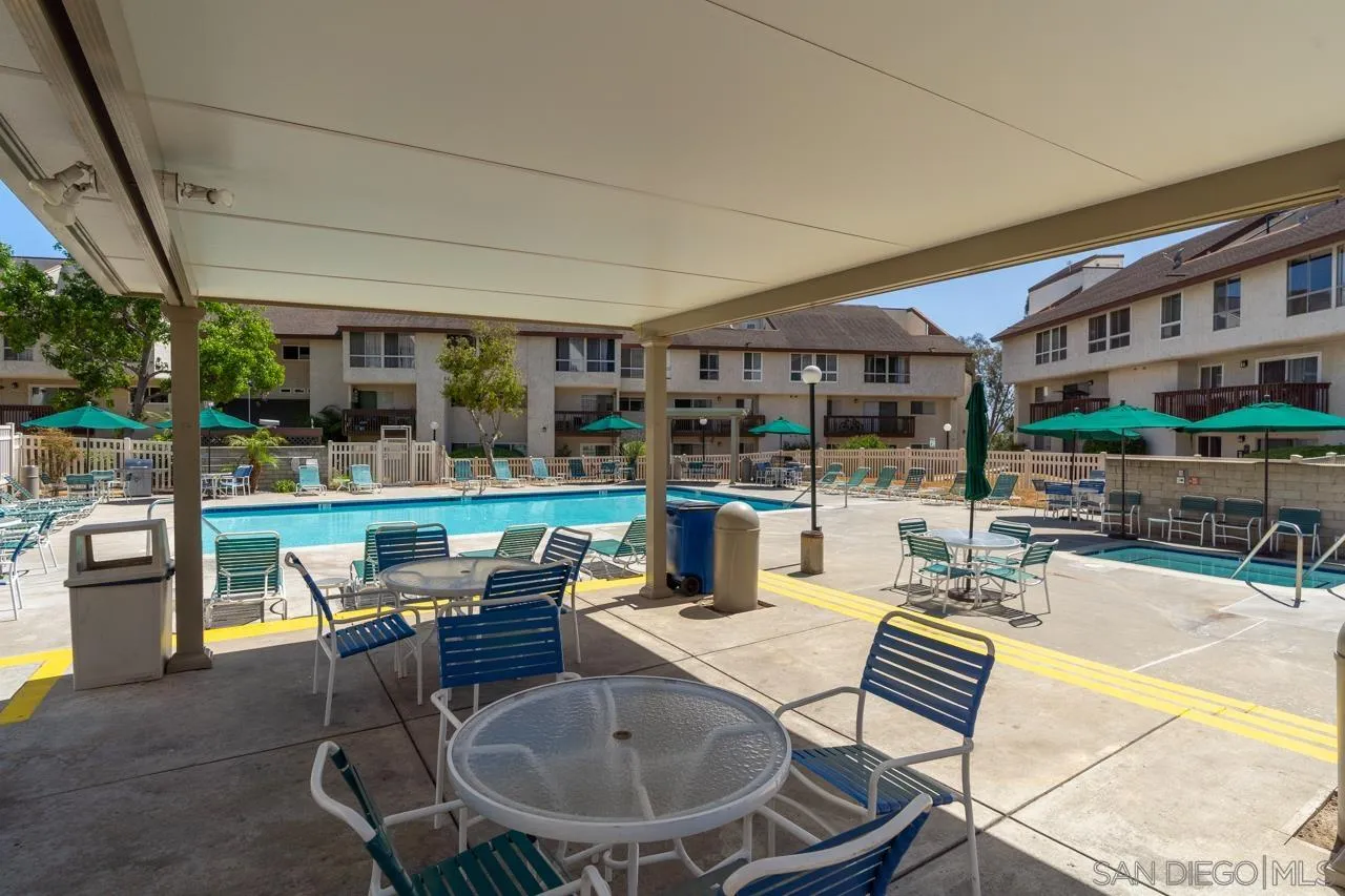 6191 Rancho Mission Road, Unit 308 San Diego, CA 92108 - Photo 29 of 31 a swimming pool with outdoor seating and outdoor seating