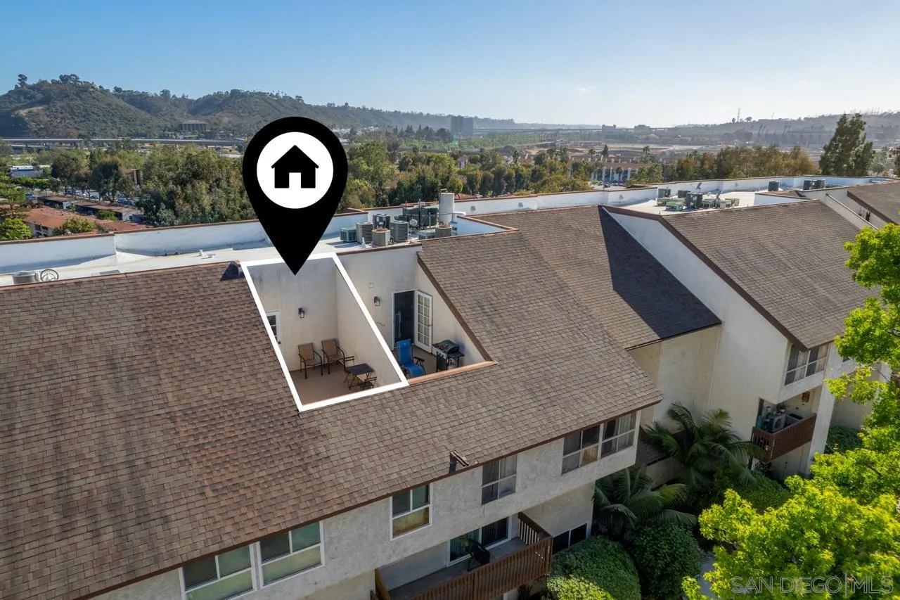 6191 Rancho Mission Road, Unit 308 San Diego, CA 92108 - Photo 3 of 31 an aerial view of a house with a yard and lake view
