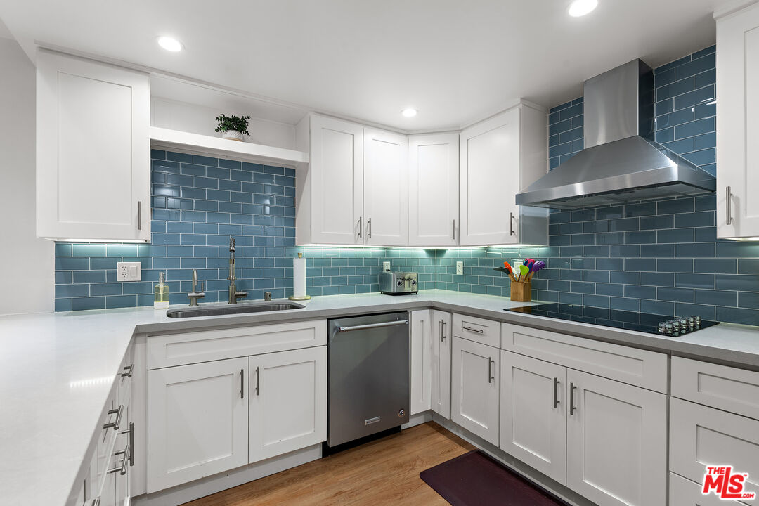 a kitchen with a sink and cabinets
