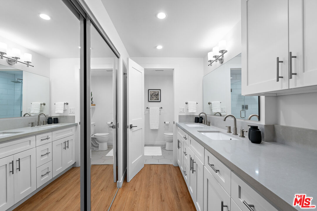 321 South San Vicente Boulevard, Unit 507 Los Angeles, CA 90048 - Photo 16 of 30 a spacious bathroom with a double vanity sink mirror and double