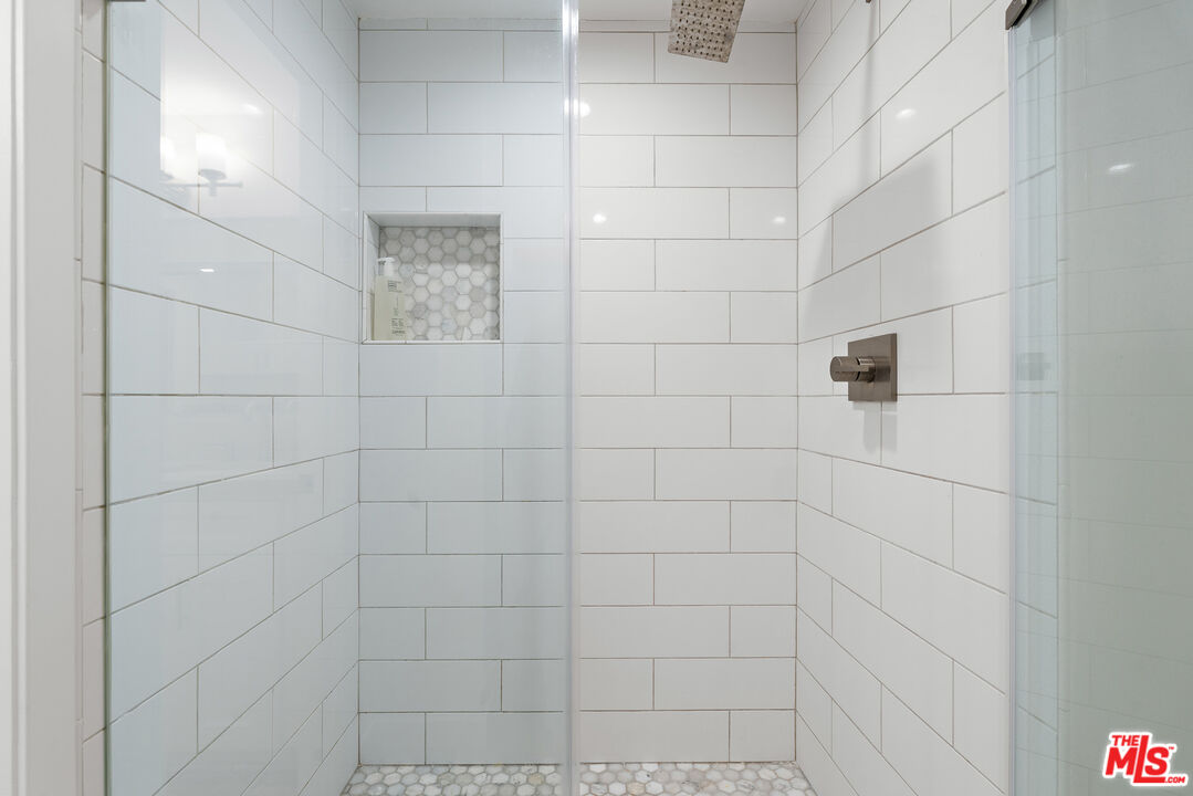 321 South San Vicente Boulevard, Unit 507 Los Angeles, CA 90048 - Photo 23 of 30 a bathroom with a shower