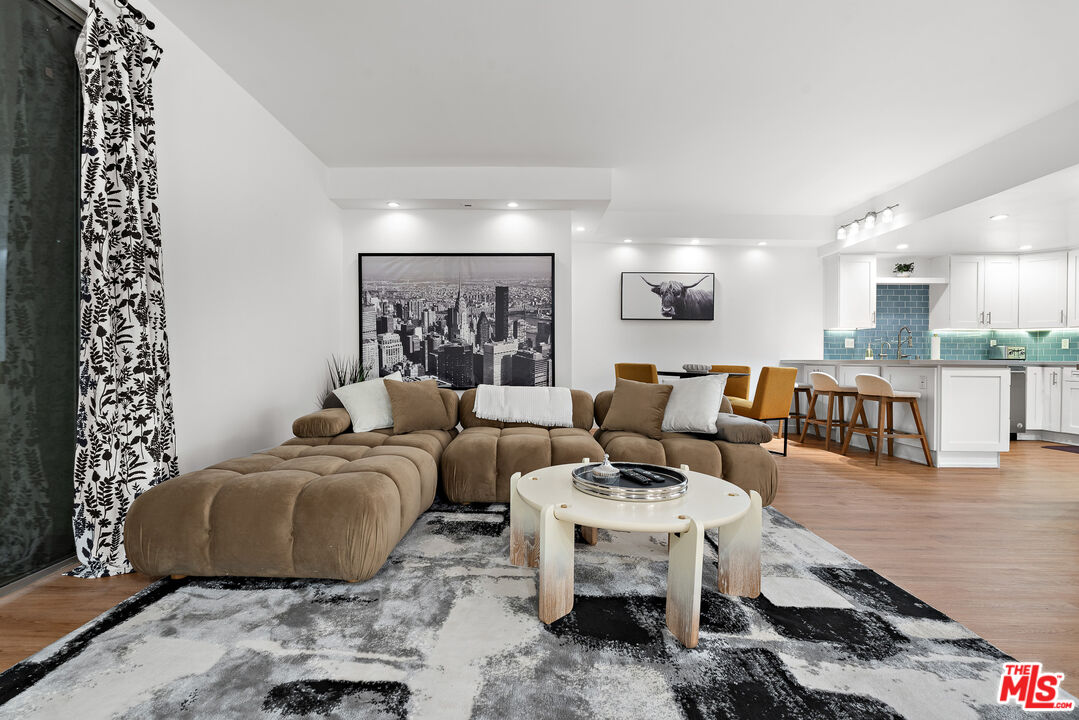 321 South San Vicente Boulevard, Unit 507 Los Angeles, CA 90048 - Photo 27 of 30 a living room with furniture and a table
