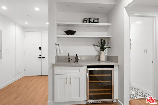 a spacious bathroom with a sink and a mirror