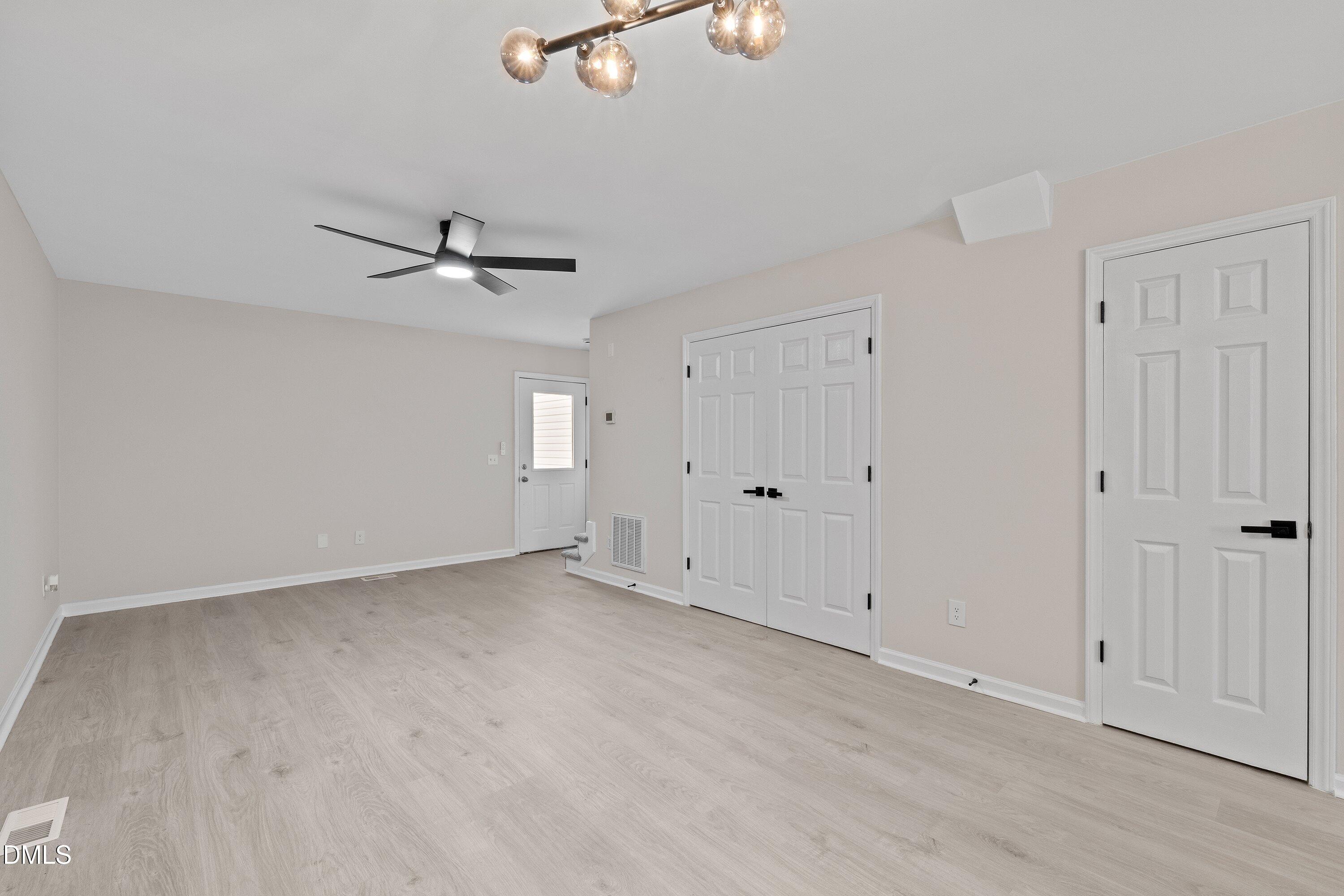 389 East Williams Street Angier, NC 27501 - Photo 11 of 26 wooden floor in an empty room