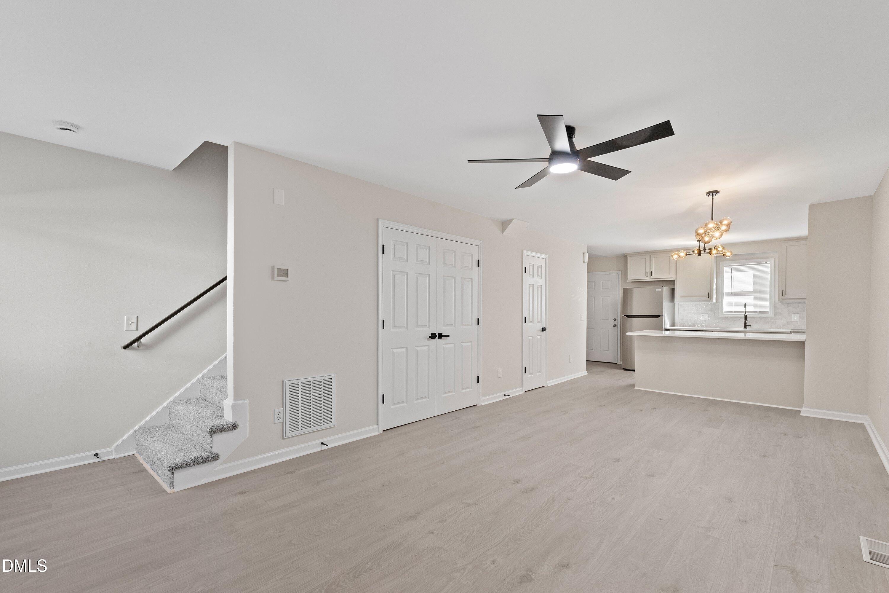 389 East Williams Street Angier, NC 27501 - Photo 12 of 26 a view of a livingroom with a ceiling fan