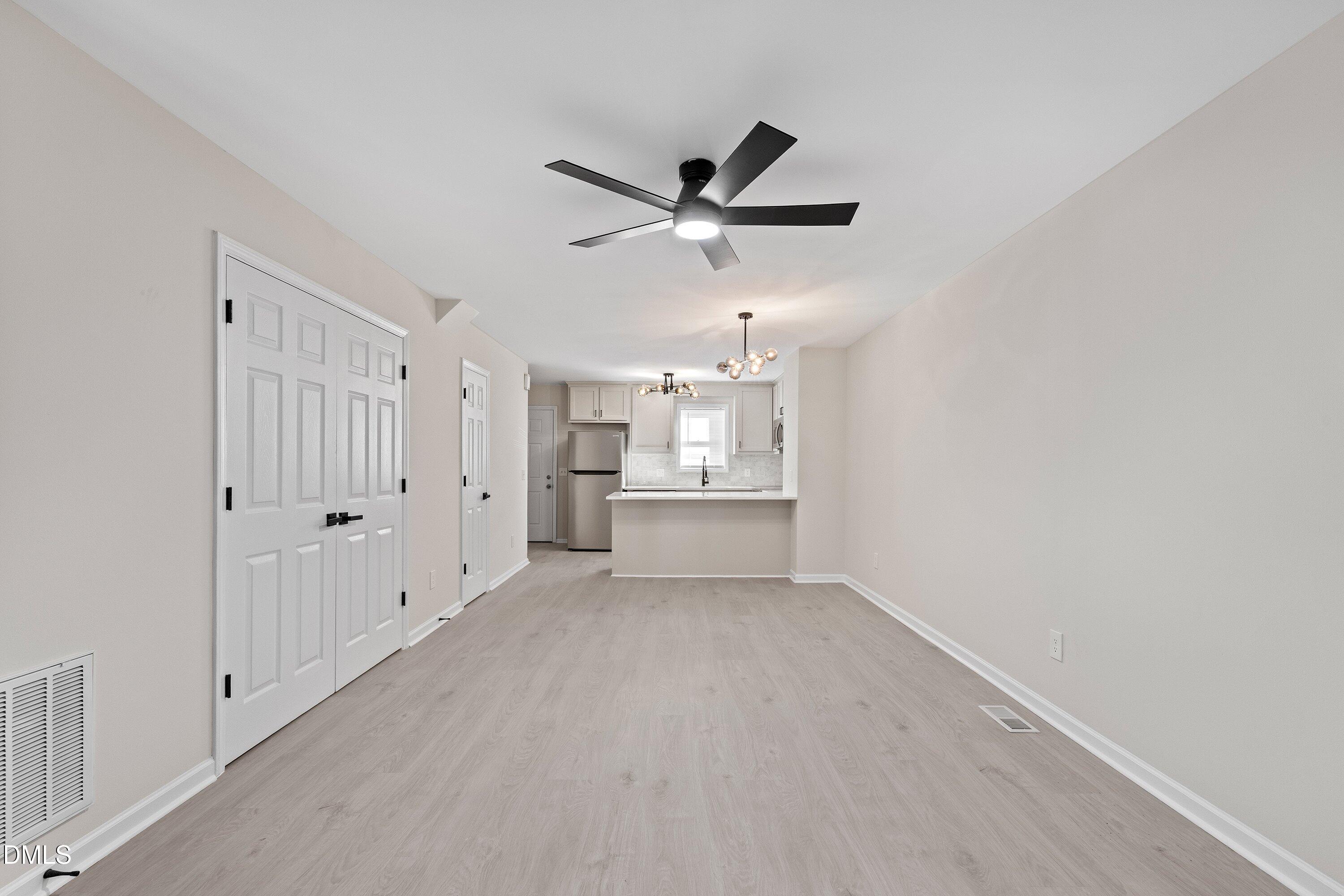 389 East Williams Street Angier, NC 27501 - Photo 13 of 26 a view of a kitchen with a sink and cabinet area
