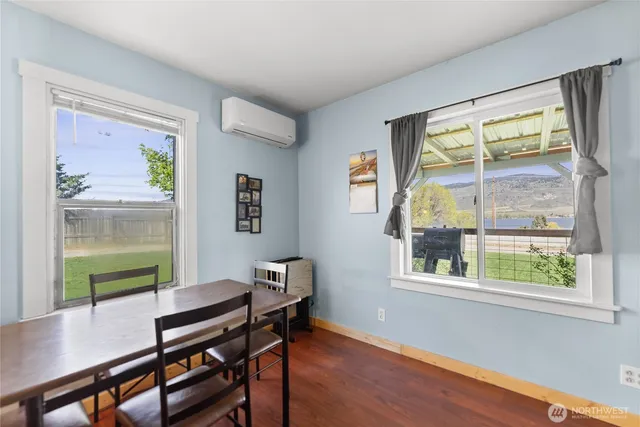 a workspace with furniture window and wooden floor