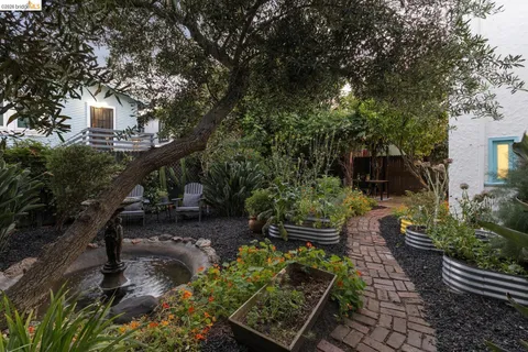 a view of an outdoor sitting space with wooden fence