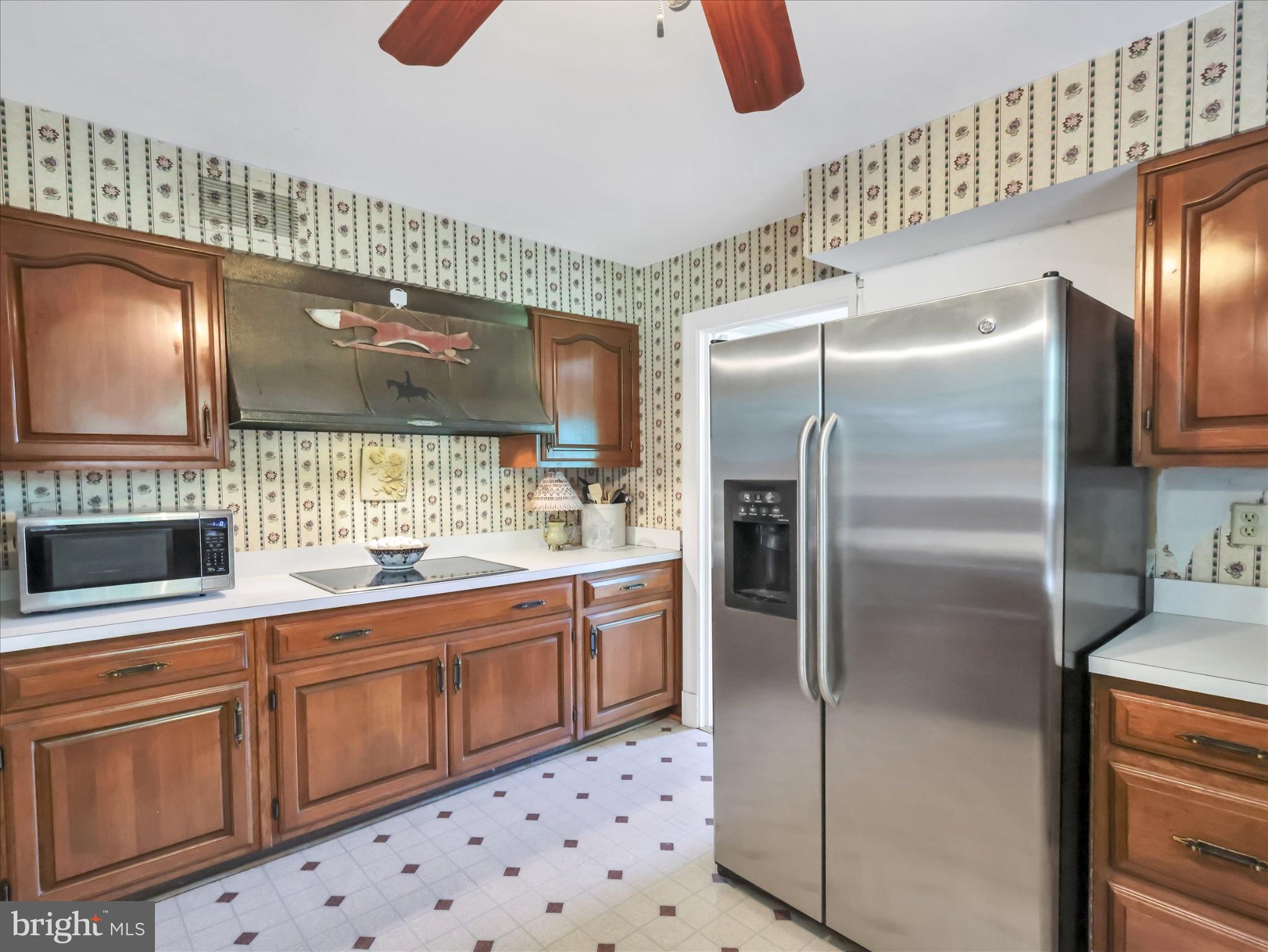 19255 Telegraph Springs Road Purcellville, VA 20132 - Photo 14 of 107 a kitchen with stainless steel appliances a refrigerator and a sink