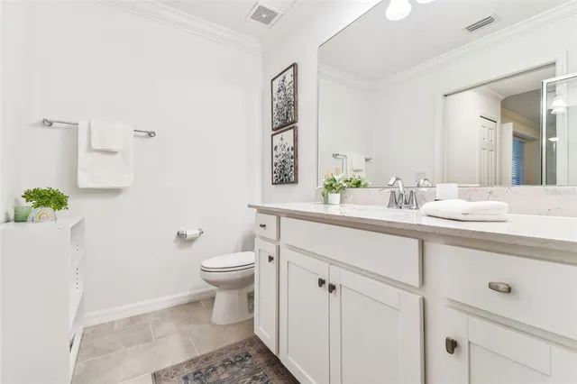 a view of a city from a balcony with furniture