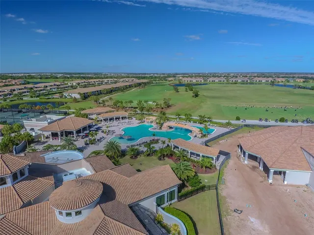 an aerial view of a building with outdoor space