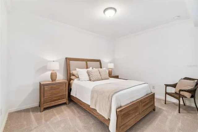 a bedroom with a bed and chair