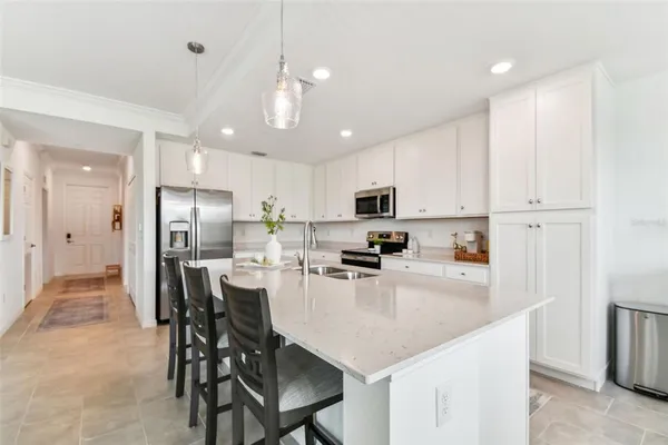 a living room filled with furniture and a large window