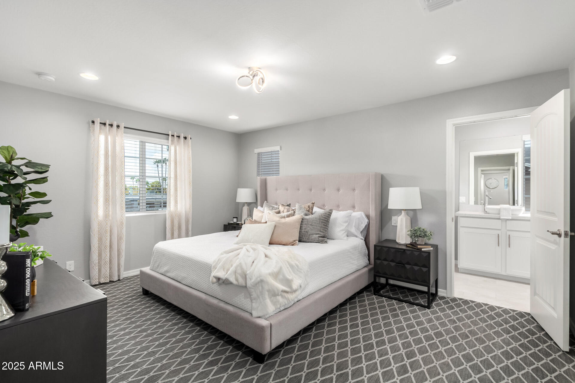 735 East Calavar Road Phoenix, AZ 85022 - Photo 13 of 38 a bedroom with a bed and wooden floor
