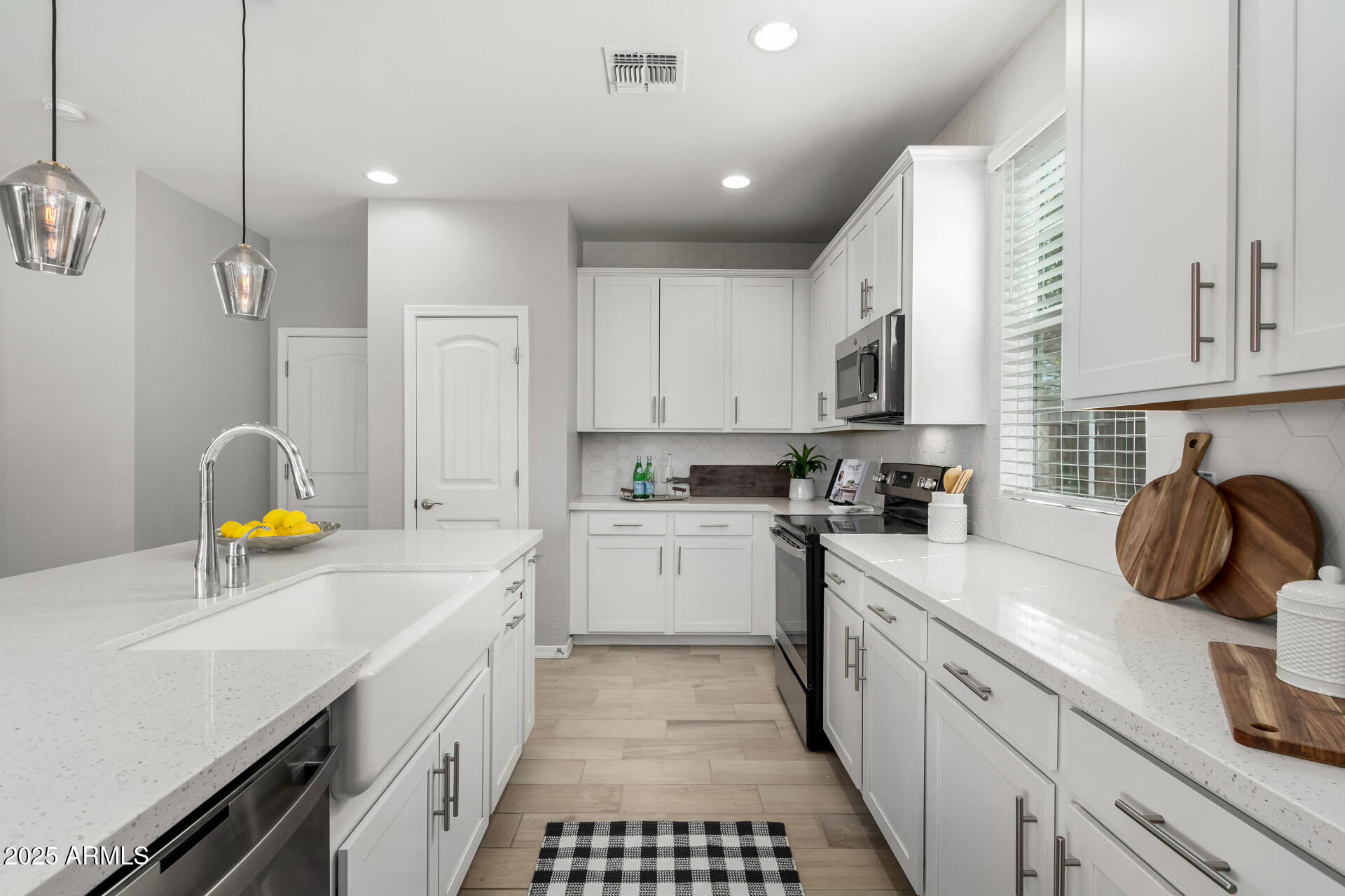 735 East Calavar Road Phoenix, AZ 85022 - Photo 8 of 38 a kitchen with a sink appliances and cabinets
