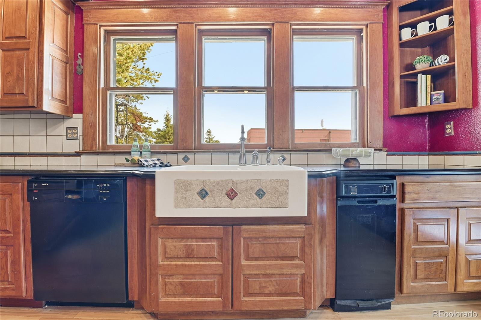 9490 Spruce Mountain Road Larkspur, CO 80118 - Photo 12 of 49 a kitchen with stainless steel appliances granite countertop a stove and a refrigerator