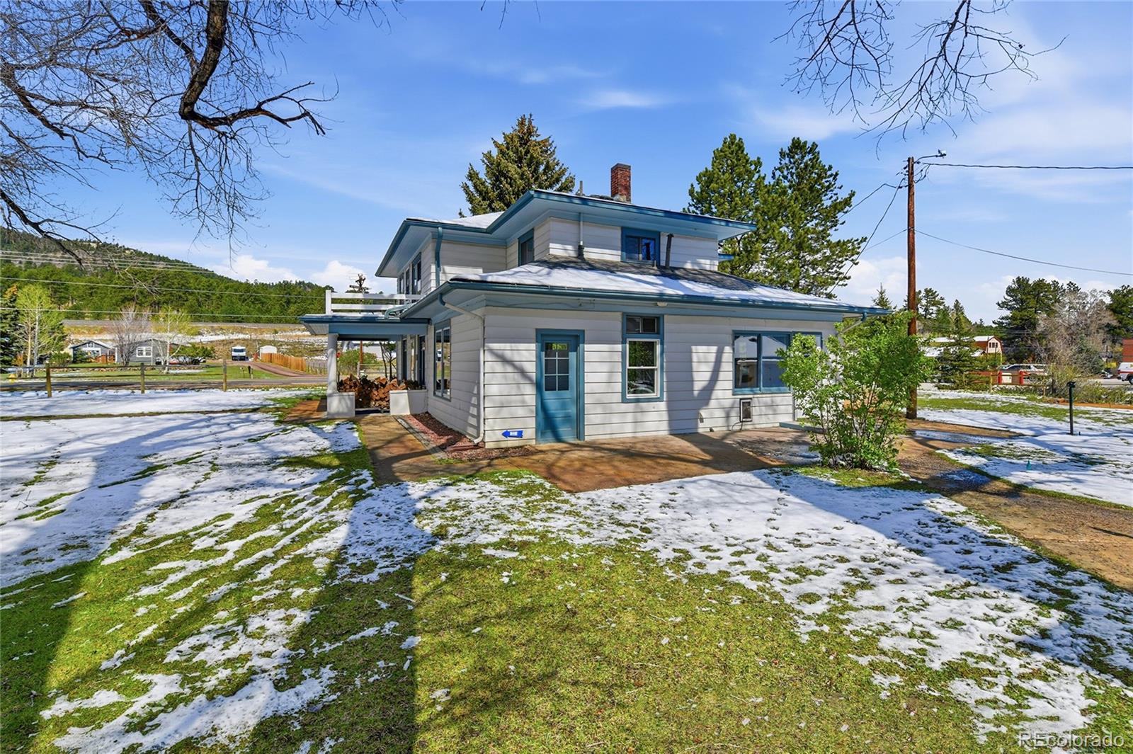 9490 Spruce Mountain Road Larkspur, CO 80118 - Photo 36 of 49 a view of a house with backyard and sitting area