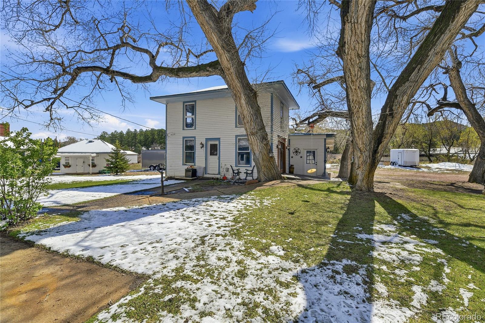 9490 Spruce Mountain Road Larkspur, CO 80118 - Photo 39 of 49 a view of a house with a yard