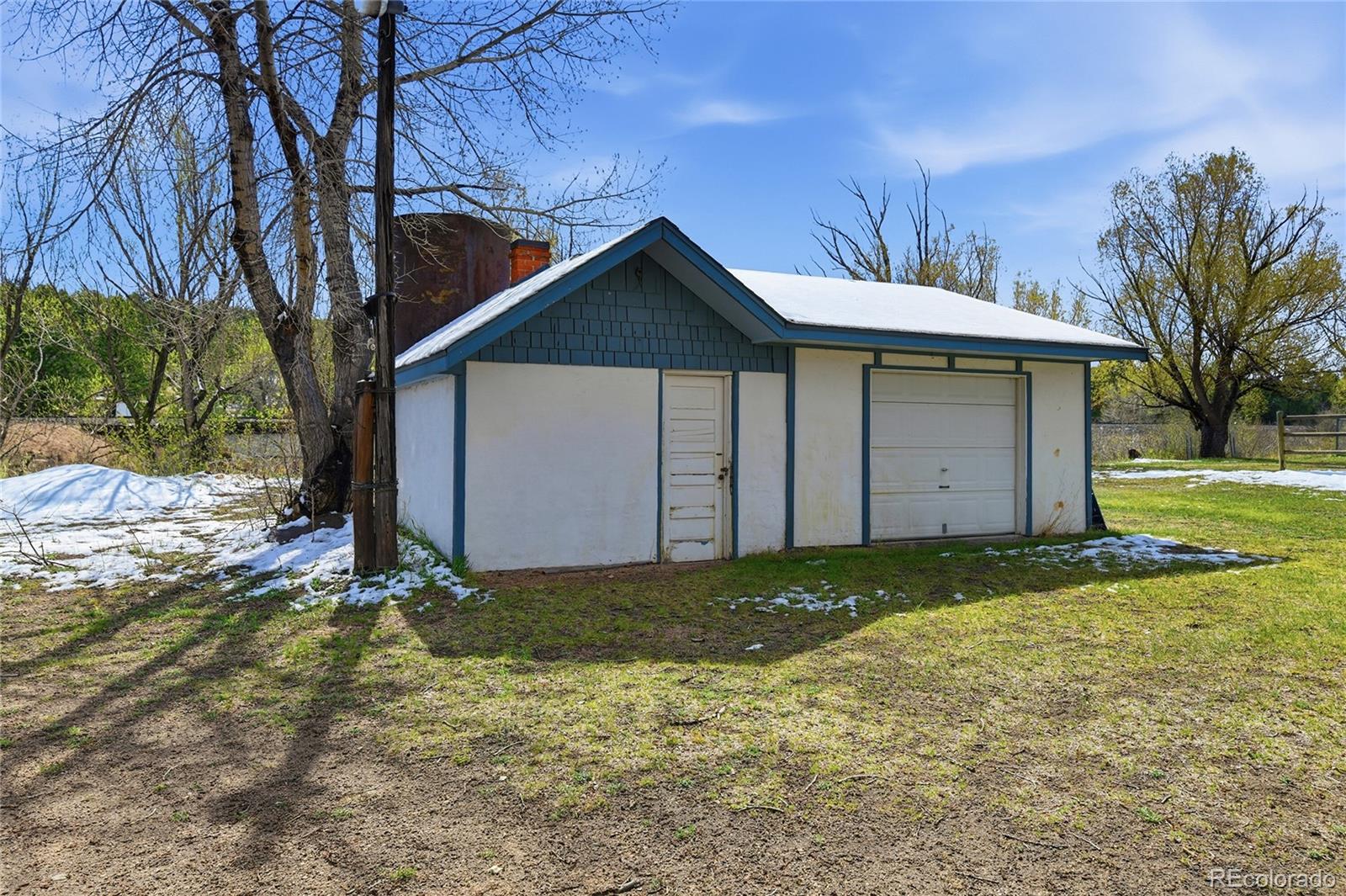 9490 Spruce Mountain Road Larkspur, CO 80118 - Photo 47 of 49 a view of a house with a yard
