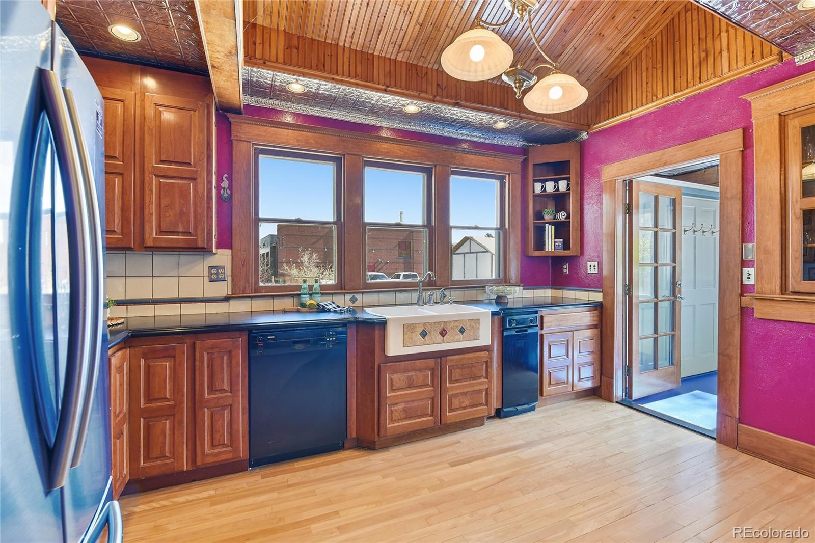 9490 Spruce Mountain Road Larkspur, CO 80118 - Photo 7 of 49 a kitchen with stainless steel appliances granite countertop a stove and cabinets