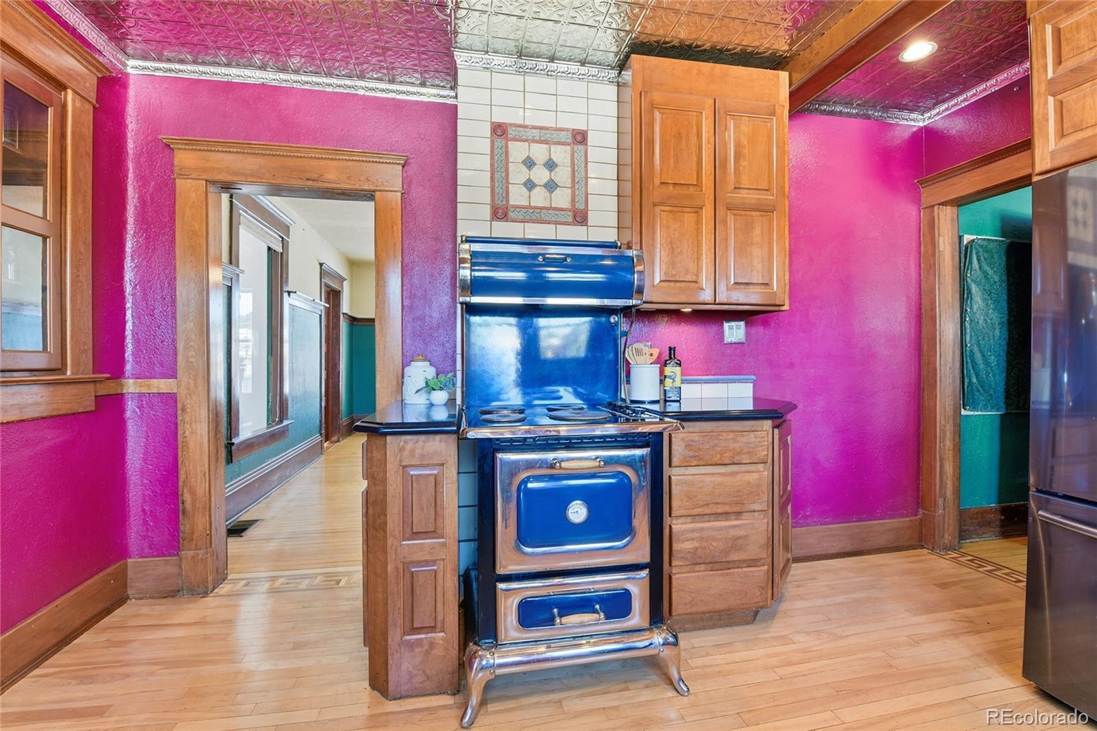 9490 Spruce Mountain Road Larkspur, CO 80118 - Photo 9 of 49 a view of a kitchen with stainless steel appliances granite countertop a stove and a window