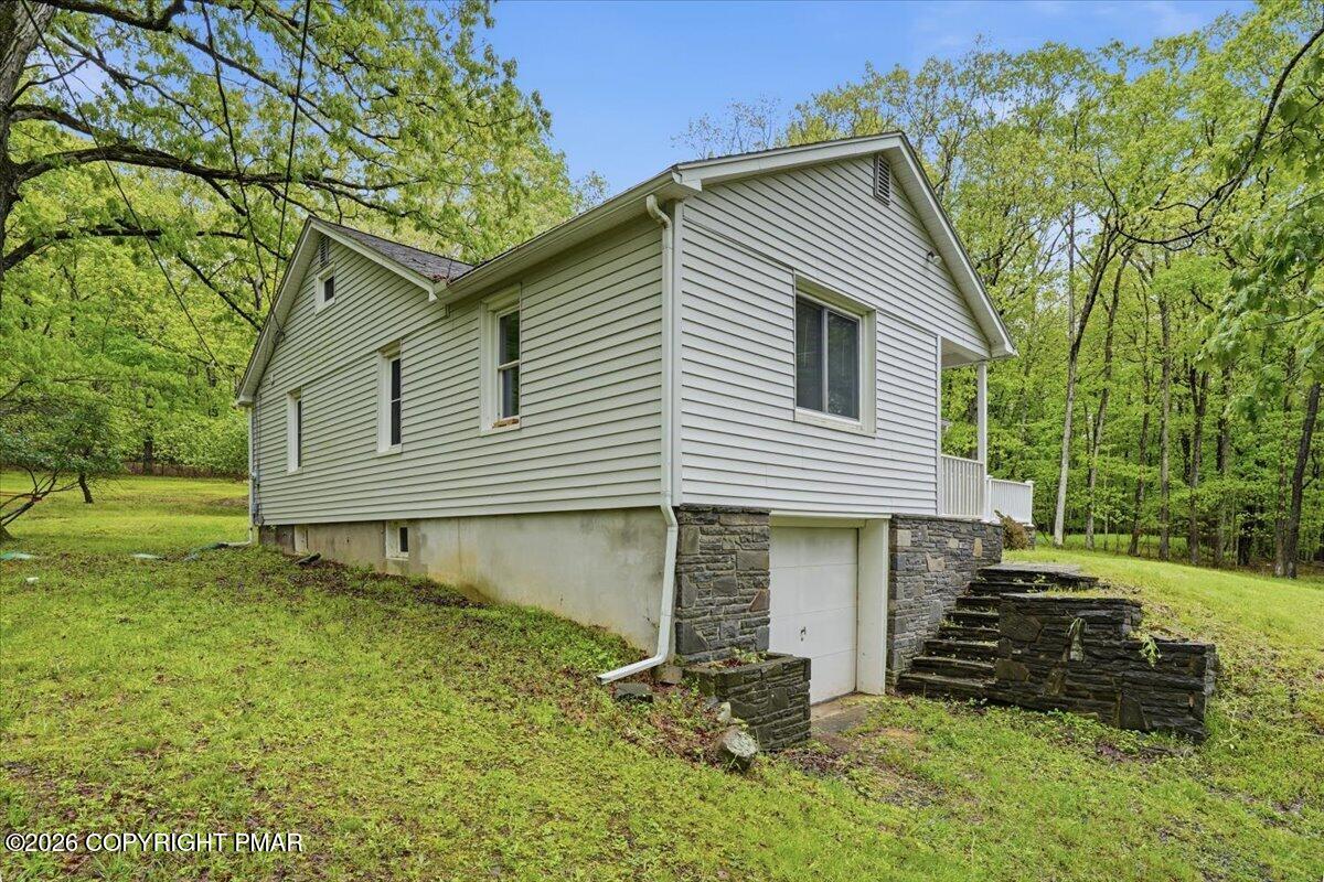 232 Garrity Road Hawley, PA 18428 - Photo 4 of 57 a front view of a house with a yard