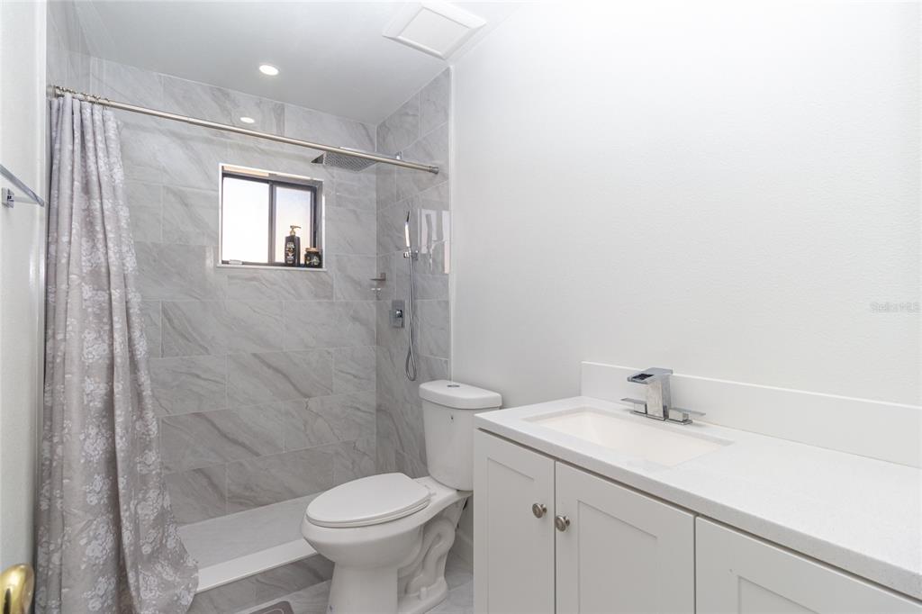 7264 Lindhurst Street Spring Hill, FL 34606 - Photo 16 of 24 a bathroom with a sink toilet and shower