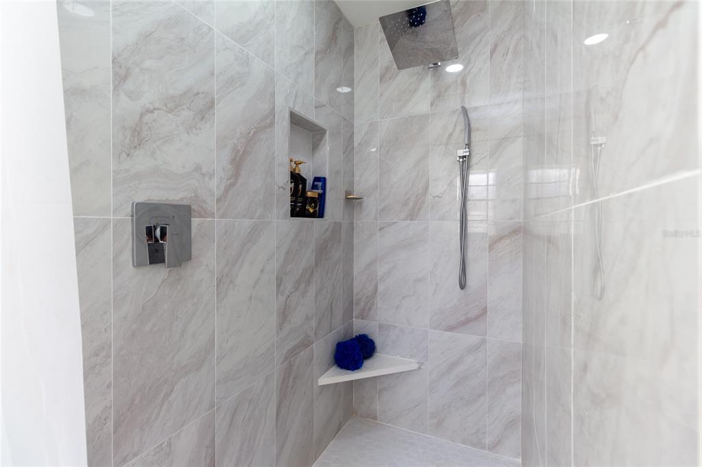 7264 Lindhurst Street Spring Hill, FL 34606 - Photo 17 of 24 a bathroom with a shower