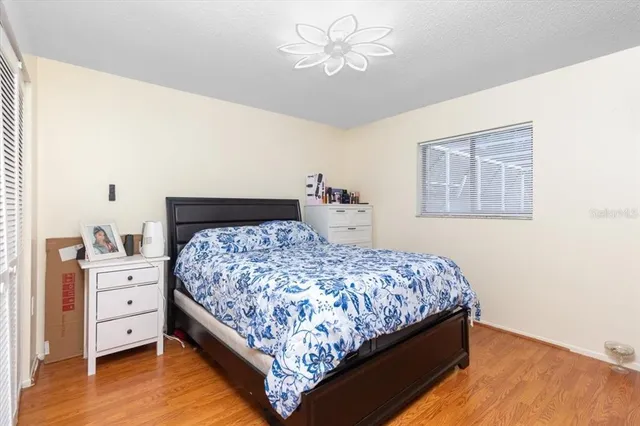 a bedroom with a bed and a dresser