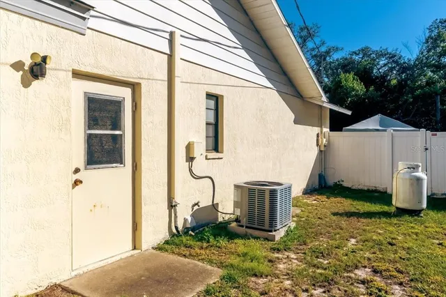 a view of front door and small yard