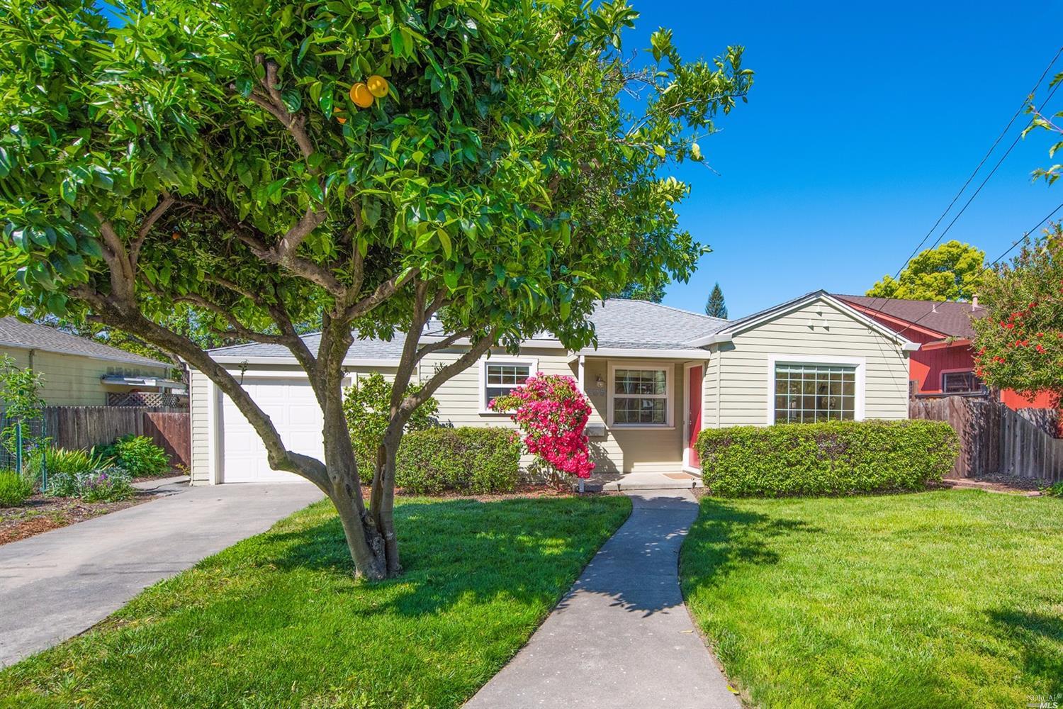 205 Gilbert Drive Santa Rosa, CA 95405 - Photo 1 of 1 a front view of a house with a yard