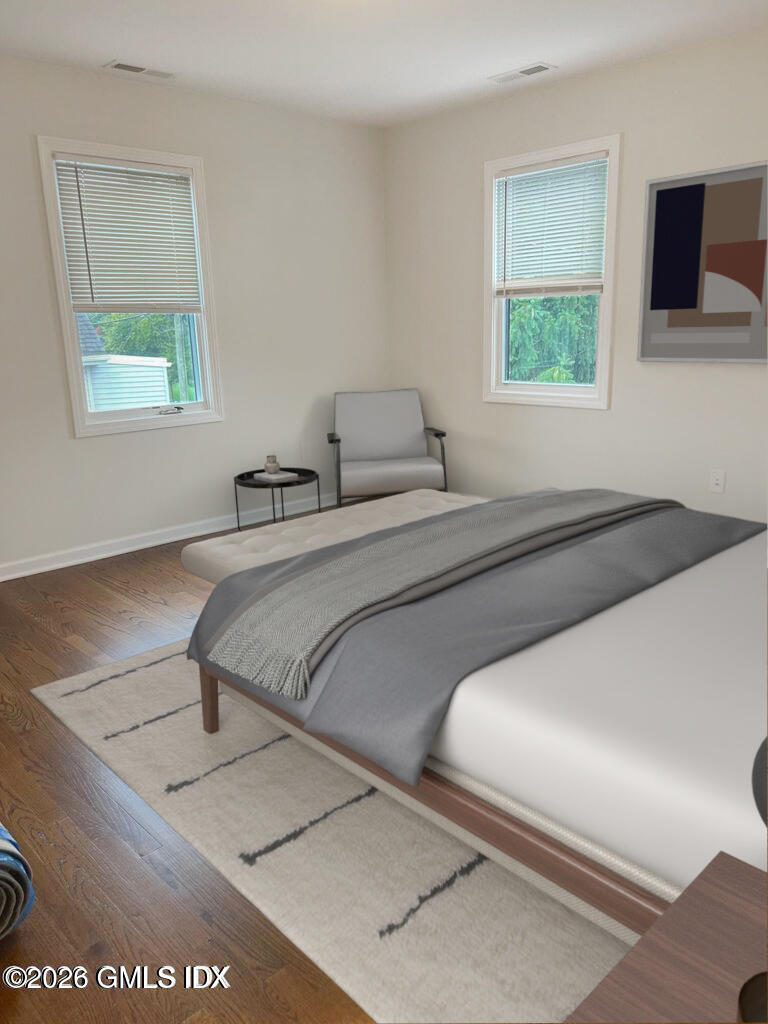 19 Bible Street, Unit 2 Cos Cob, CT 06807 - Photo 11 of 26 a bedroom with a bed and a window