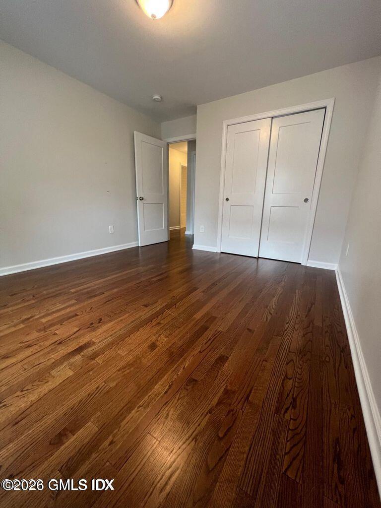 19 Bible Street, Unit 2 Cos Cob, CT 06807 - Photo 12 of 26 wooden floor in an empty room
