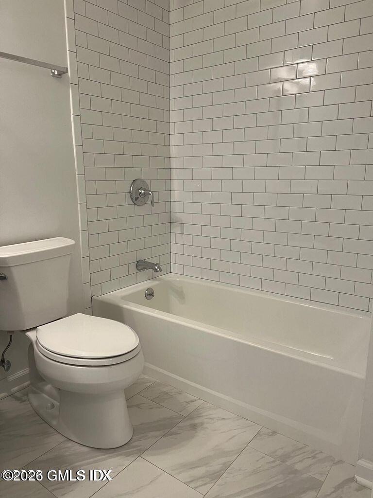 19 Bible Street, Unit 2 Cos Cob, CT 06807 - Photo 14 of 26 a bathroom with a toilet and a bath tub