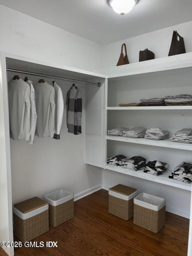 19 Bible Street, Unit 2 Cos Cob, CT 06807 - Photo 18 of 26 a view of walk in closet with clothes and shoes