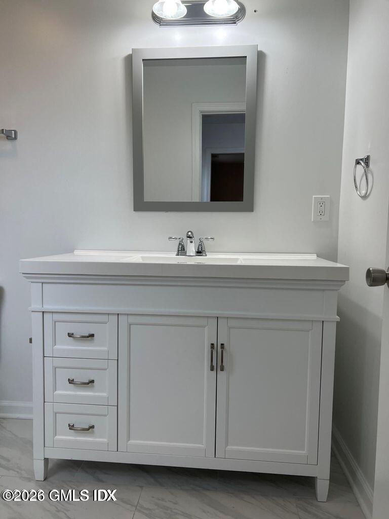19 Bible Street, Unit 2 Cos Cob, CT 06807 - Photo 19 of 26 a bathroom with a sink vanity and a mirror
