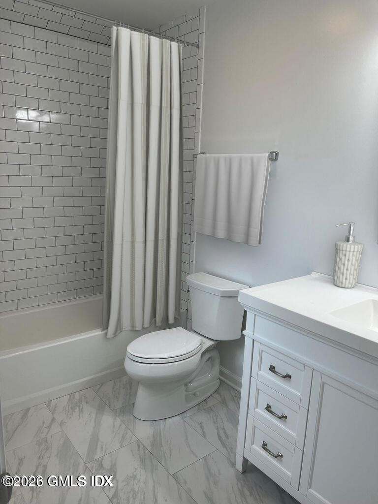 19 Bible Street, Unit 2 Cos Cob, CT 06807 - Photo 20 of 26 a bathroom with a toilet a sink and bathtub
