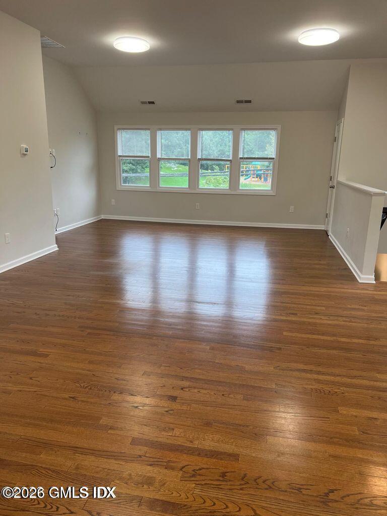 19 Bible Street, Unit 2 Cos Cob, CT 06807 - Photo 2 of 26 wooden floor in an empty room with a window