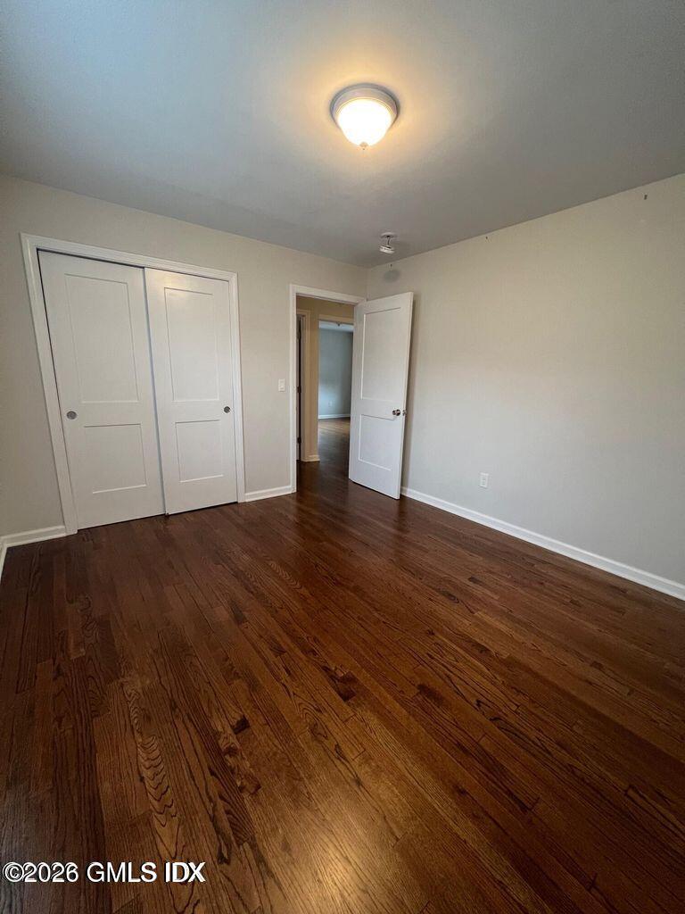 19 Bible Street, Unit 2 Cos Cob, CT 06807 - Photo 22 of 26 a view of an empty room with wooden floor