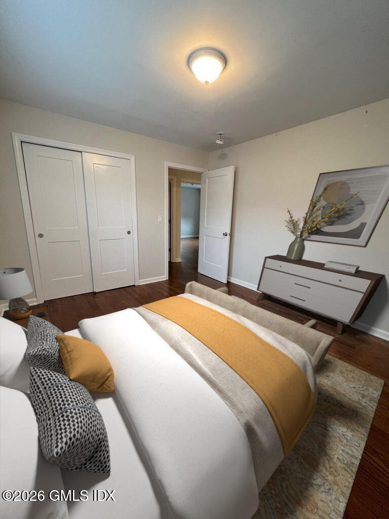 19 Bible Street, Unit 2 Cos Cob, CT 06807 - Photo 23 of 26 a bedroom with a bed and wooden floor