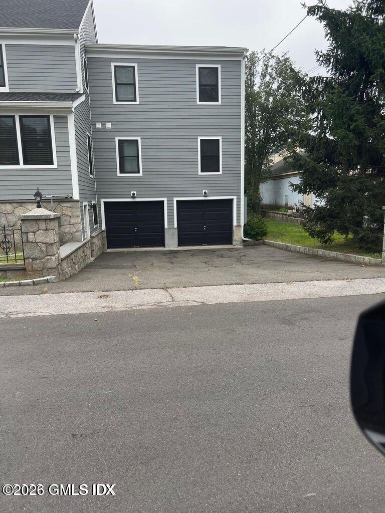 19 Bible Street, Unit 2 Cos Cob, CT 06807 - Photo 24 of 26 a front view of house with yard